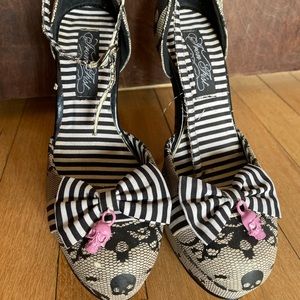 Iron fist platform heels with lace and skull detail